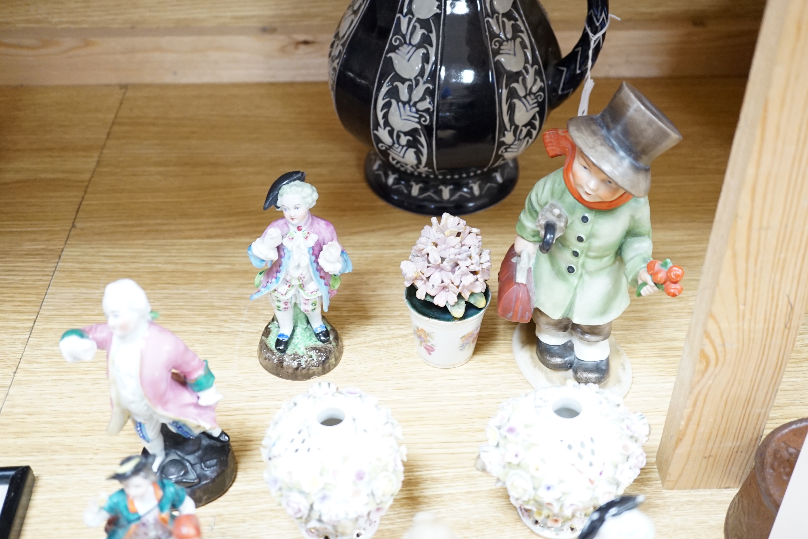 Mixed ceramics; a Madonna and child group, a jug, a pair of Sitzendorf miniature flower encrusted vases, nine small German style figures, etc. (18)